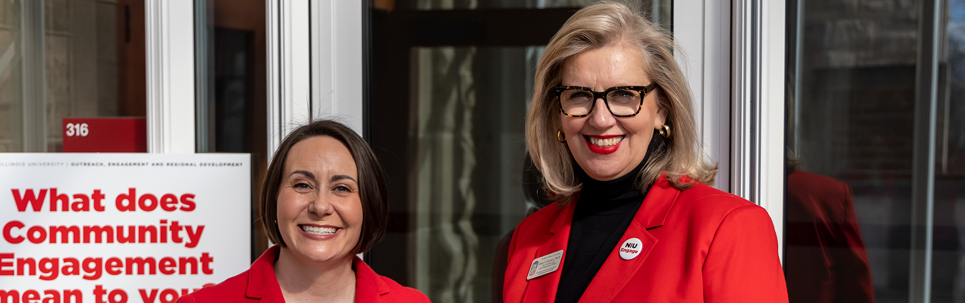 NIU staff reviewing documents together